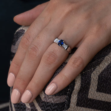 0.90ct natural blue sapphire and diamond ring in 18k white gold on hand